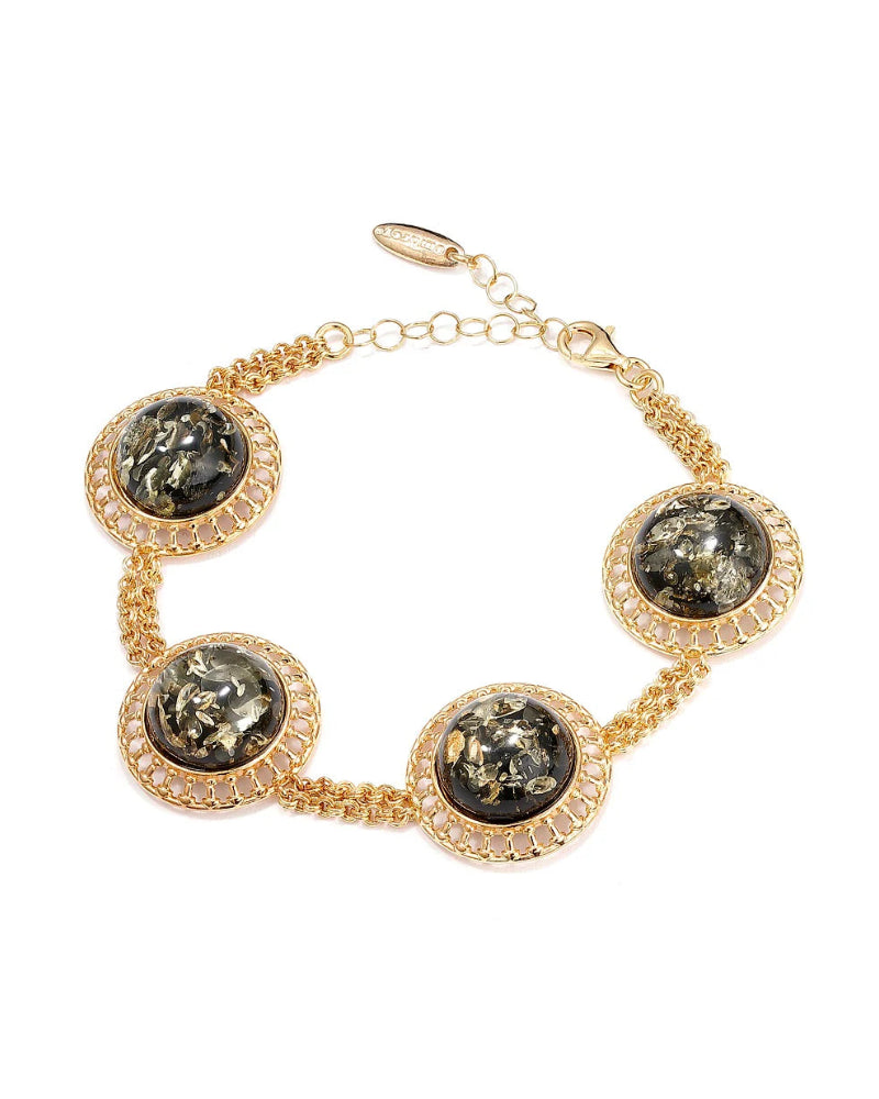 Gold bracelet with black stone accents on a white background